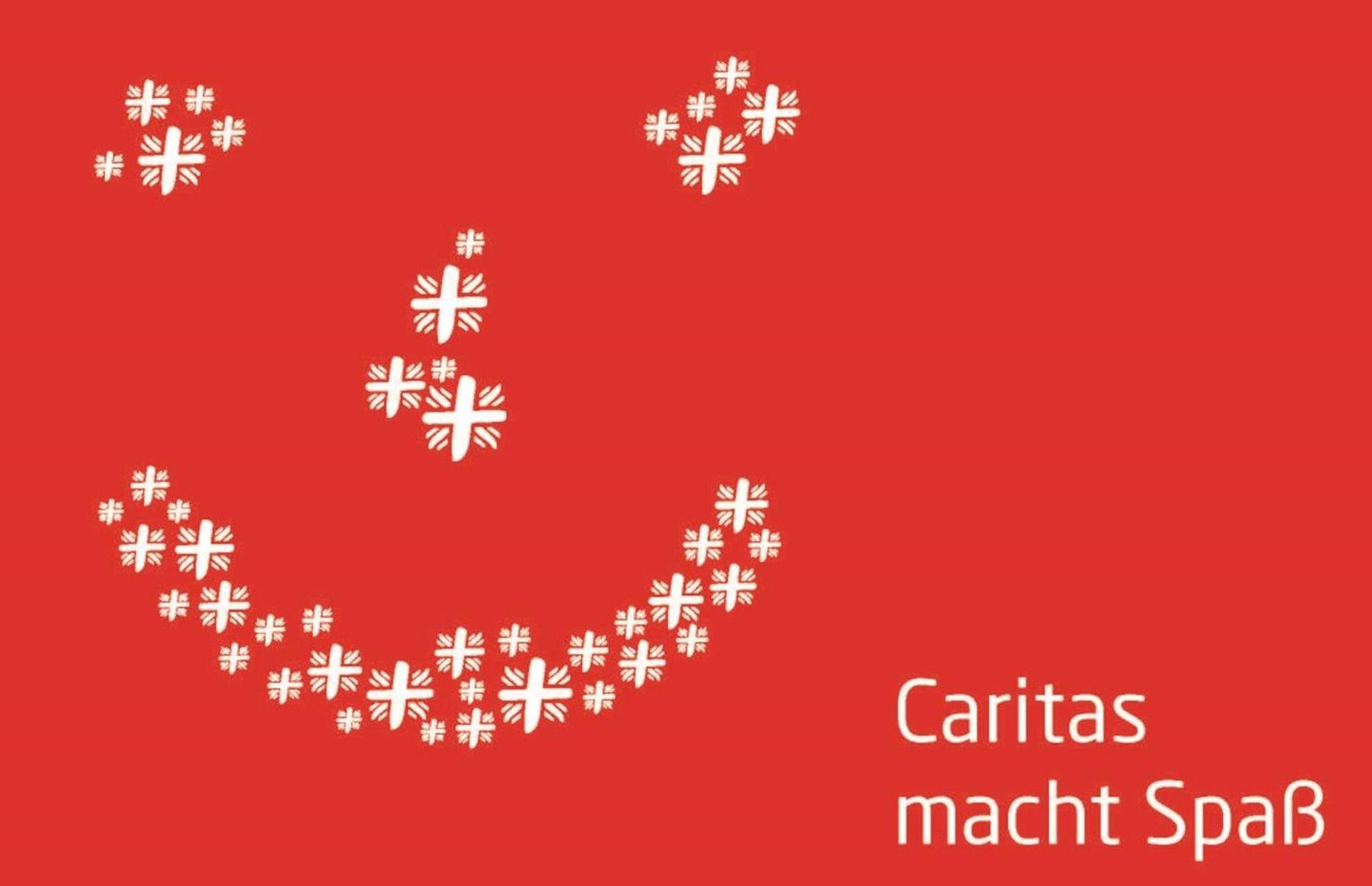 Augen, Nase und Mund aus weißen Flammkreuzen auf rotem Grund